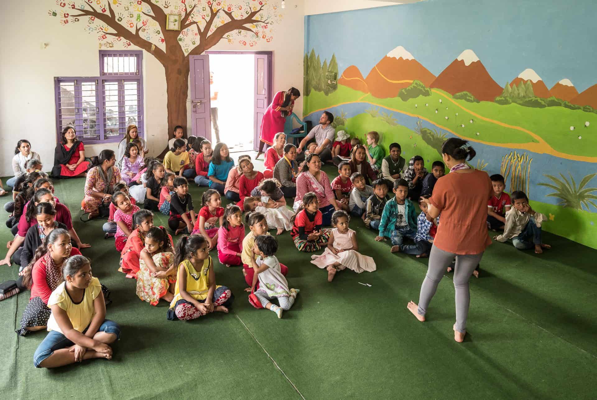 Children sit in a classroom at the Himalayan Life Sport Training & Daycamps