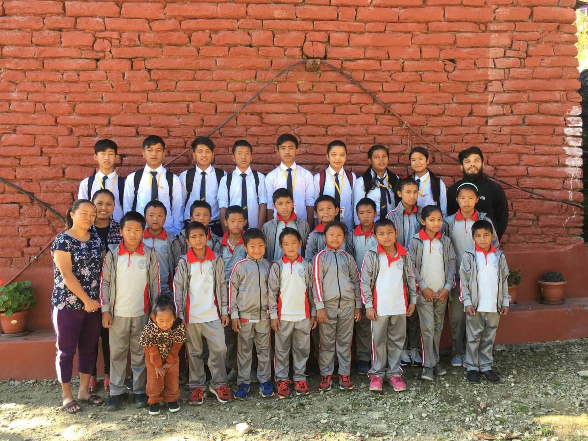 Children from the Ulleri Children's home by Himalayan Life stand outside their home