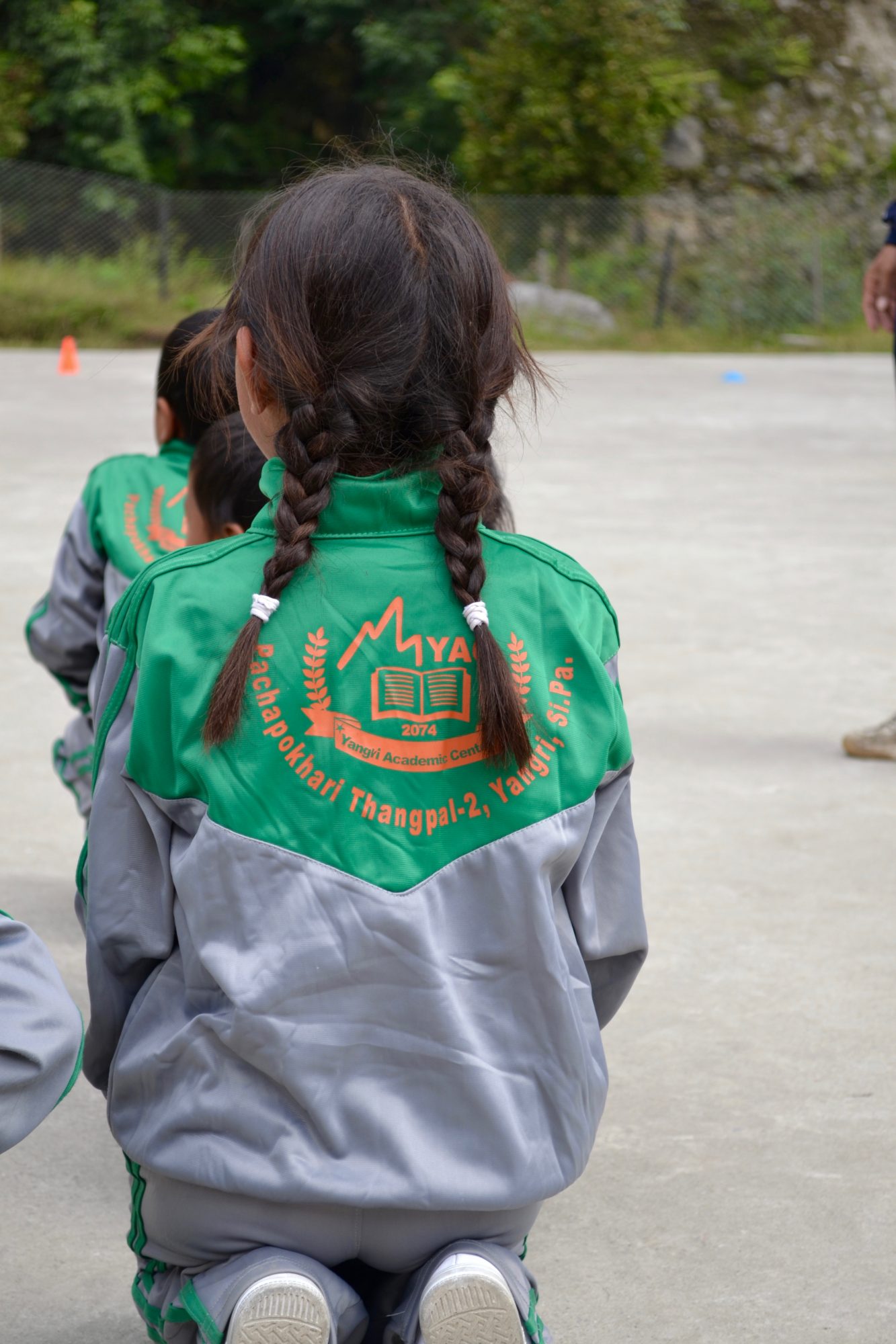 Little girl in a Yangri Academic Center uniform