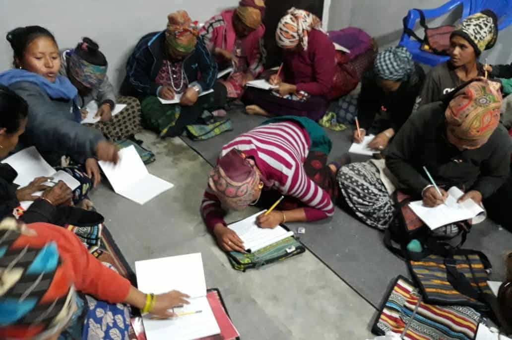 A group of women learn how to read and write in Nepal