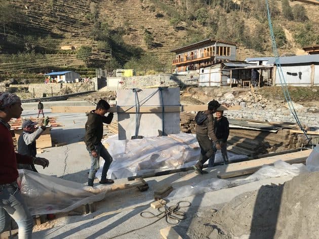 Street children check out the new school in Yangri, Nepal construction site