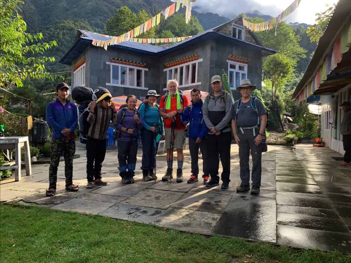 Everest hiking group standing in mountain village square