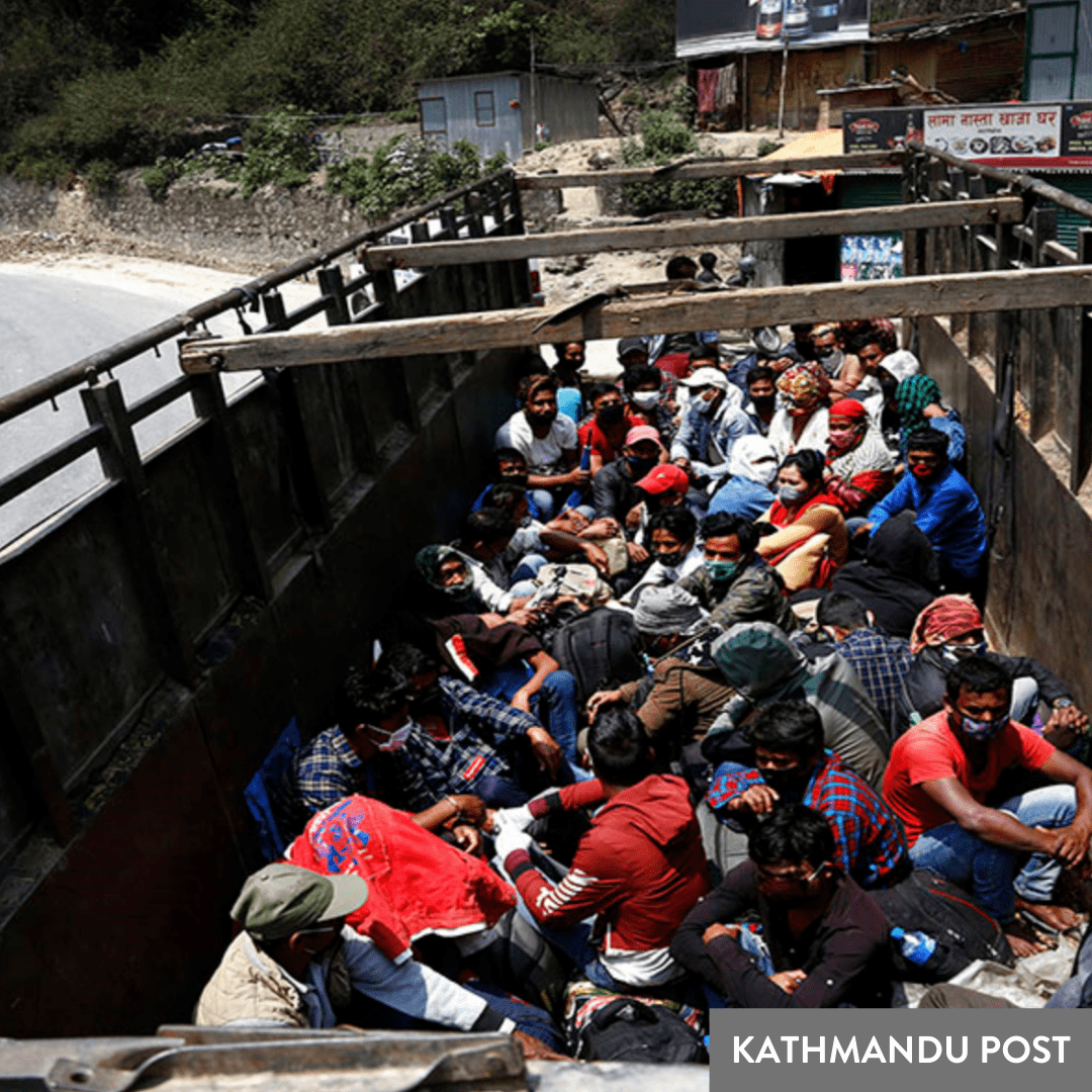 Migrant workers return home to Nepal by truck after loosing jobs abroad.