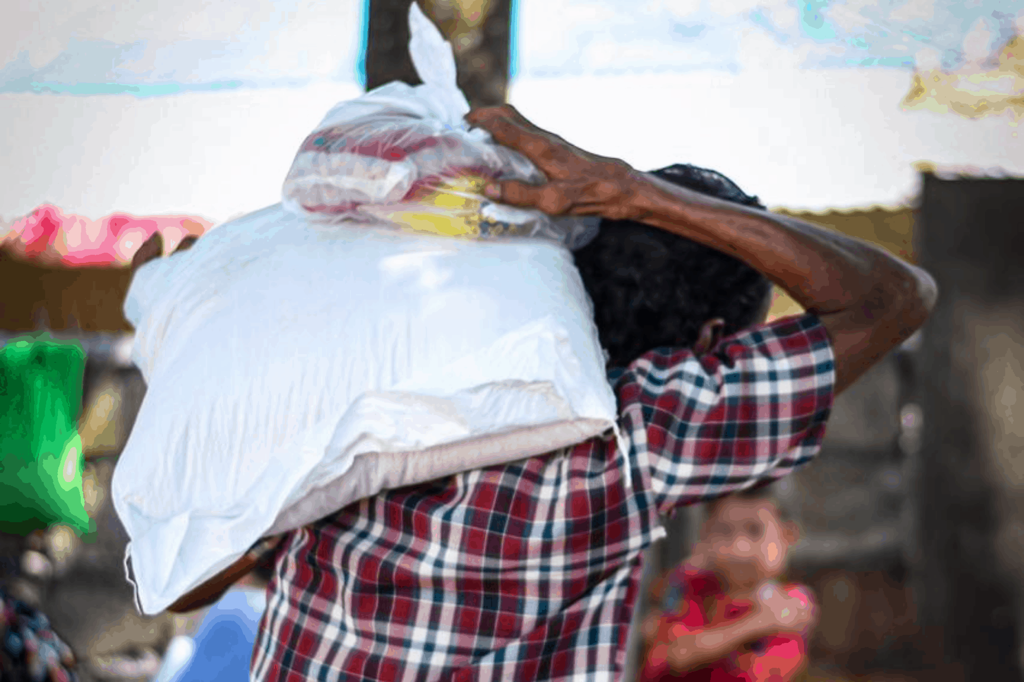 Man in Chitwan carries COVID-19 relief package given by Himalayan Life Chitwan
